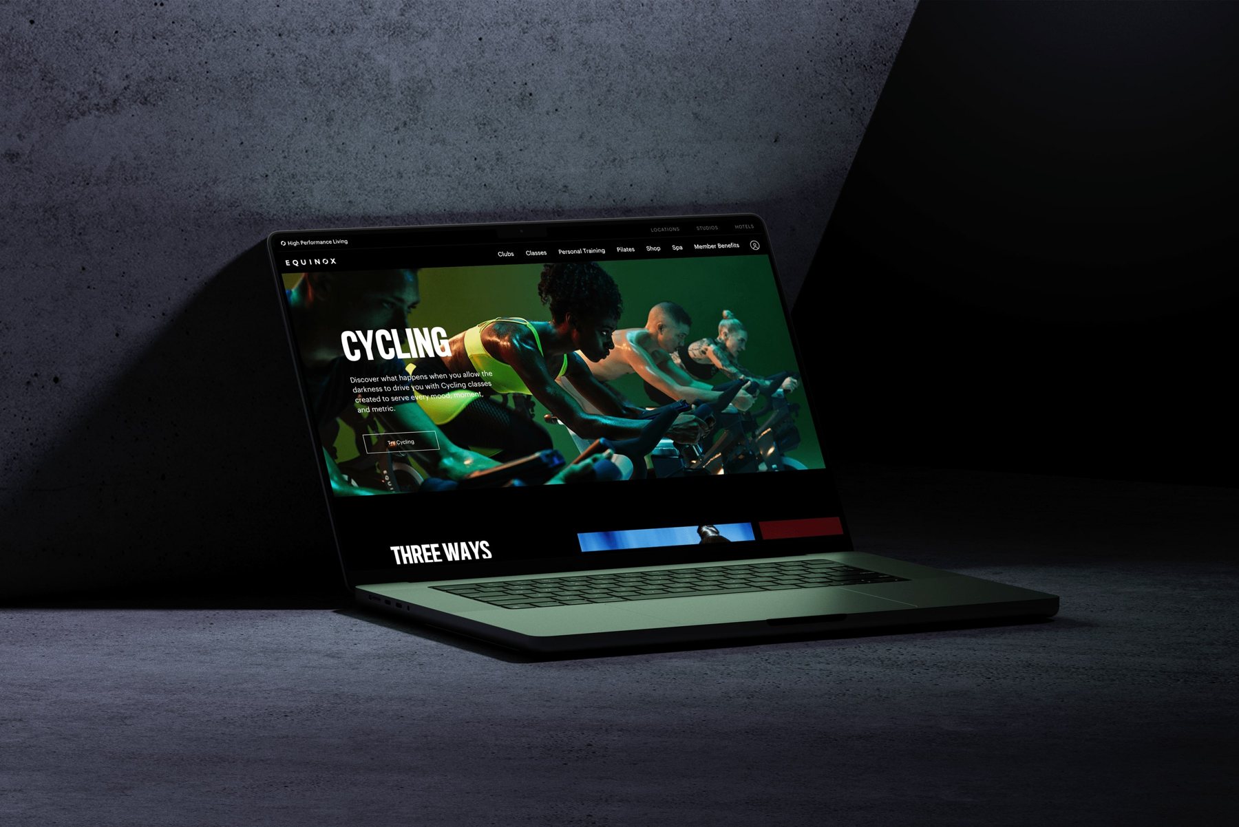 Equinox.com on a laptop in a dark room
